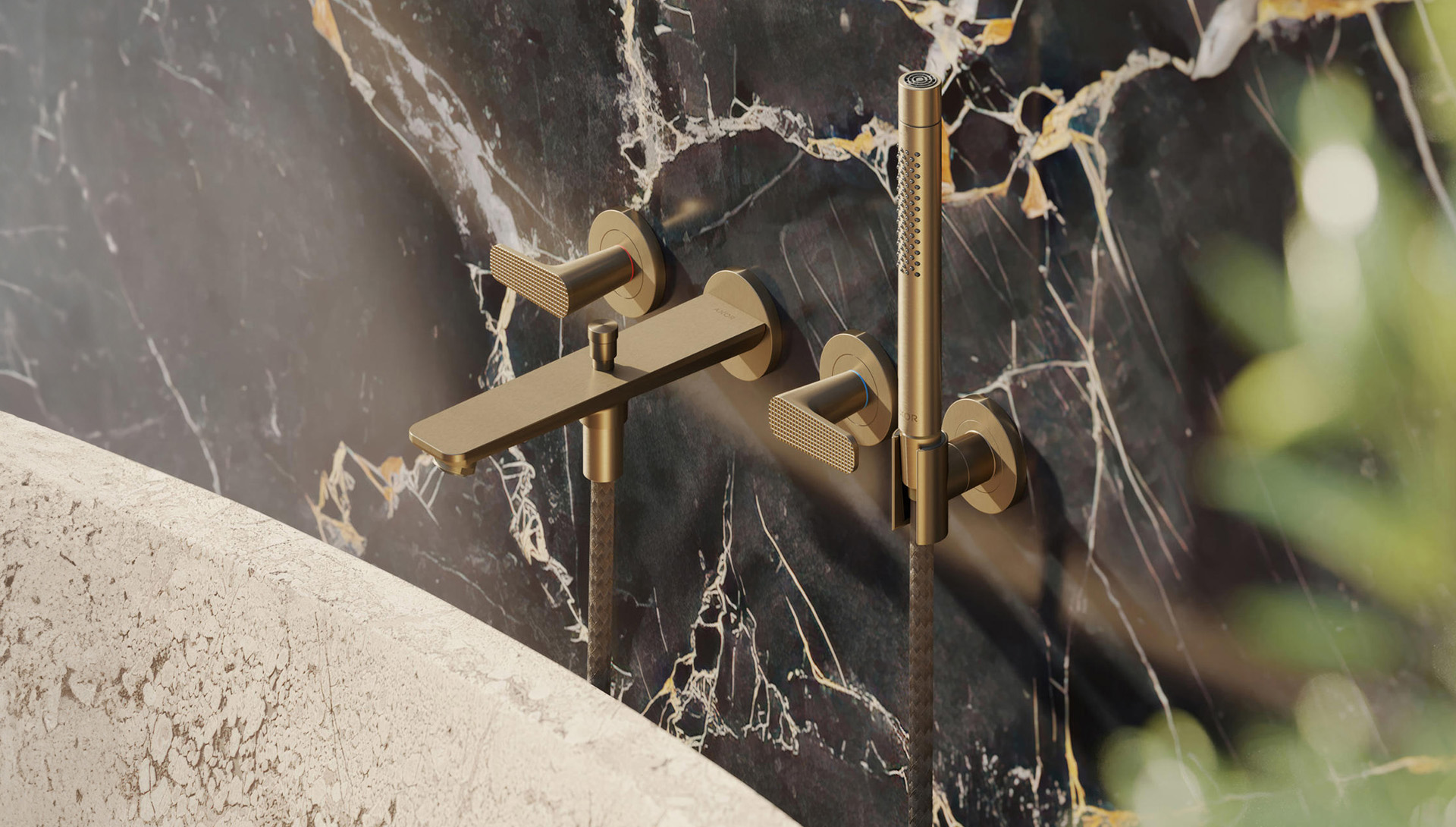 Designer brush gold bath taps and shower in luxury bathroom